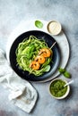 Zucchini spaghetti with pesto sauce and grilled shrimp skewers. Vegetarian vegetable low carb pasta. Zucchini noodles or zoodles. Royalty Free Stock Photo