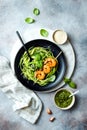 Zucchini spaghetti with pesto sauce and grilled shrimp skewers. Vegetarian vegetable low carb pasta. Zucchini noodles or zoodles. Royalty Free Stock Photo