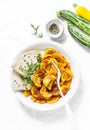 Zucchini squash curry sauce and whole grain flatbread on a light background, top view. Indian vegetarian healthy food