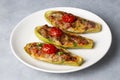 Zucchini stuffed with meat, vegetables and cheese. Zucchini boats. Turkish name kabak sandal Royalty Free Stock Photo