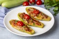 Zucchini stuffed with meat, vegetables and cheese. Zucchini boats. Turkish name kabak sandal Royalty Free Stock Photo