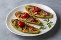 Zucchini stuffed with meat, vegetables and cheese. Zucchini boats. Turkish name kabak sandal Royalty Free Stock Photo
