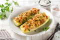 Zucchini stuffed with minced meat and tomatoes and cheese