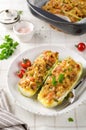 Zucchini stuffed with minced meat and tomatoes and cheese