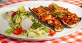 Zucchini stuffed vegetables and salad - letuce with cherry tomatoes, radish and cucumber Royalty Free Stock Photo