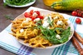 Zucchini waffles with goat cheese, tomatoes, arugula. Proper nutrition. Healthly food