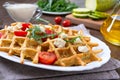 Zucchini waffles with goat cheese, tomatoes, arugula. Proper nutrition. Healthly food