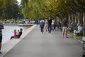 View of the lakeshore boardwalk of Lake Zug with people