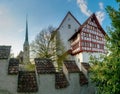 Zug, ZG / Switzerland - 20 April, 2019: view of the historic fortress Burg Zug and church of Saint Oswald in the city of Zug on a