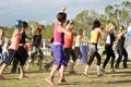 Zumba dancing fitness instructor teaching women the moves