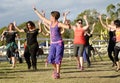 Zumba dancing instructor with smiling dancing people Royalty Free Stock Photo