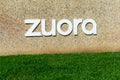 Zuora sign on green grass at company headquarters . Zuora creates and provides software for businesses to launch and manage their