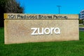 Zuora sign on green grass at company headquarters . Zuora creates and provides software for businesses to launch and manage their