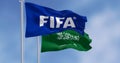 FIFA and Saudi Arabian flags waving in the wind