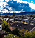 Zurich chruch tower old town historic city centre valley view from zurich university switzerland sun shadow mountain Royalty Free Stock Photo