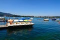 15-07-2023 Zurich city, Switzerland. Rental pedal boats in a row on a dock, on lake Zurich Royalty Free Stock Photo