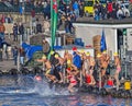 Zurich Samichlaus-Schwimmen participants jumping into the water