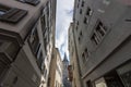 Narrow street in old Zurich. In the distance the clock tower of St. Peter\'s Church Royalty Free Stock Photo