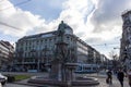 People, cars and monument to Alfred Escher on Bahnhofplatz square