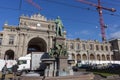 People, cars and monument to Alfred Escher on Bahnhofplatz square