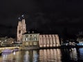 Zurich Switzerland Grossmunster cathedral in autumn night from river Limat