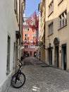 Zurich, Switzerland - June 27, 2019: Swiss flags in tiny pedestrian street in the old town of Zurich Royalty Free Stock Photo