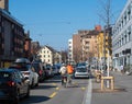 Zurich, Switzerland - March 5th 2022: Cyclists overtaking a traffic jam on a cycling trail