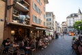 31-05-2023 Zurich, Switzerland. Tourists enjoying food on the terrace of restaurants in historic downtown