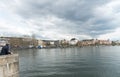 Zurich, ZH / Switzerland - April 8, 2019: tourist admires the cityscape and lakeshore view of Zurich during the hustle and bustle