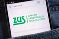 ZUS Polish social security website displayed on smartphone hidden in jeans pocket