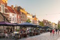 Restaurants with people on the Houtmarkt central square in the D