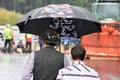 Two men with an umbrella from behind, Austria, Europe