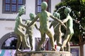 Zwickau, Germany - July 21, 2023: Sculpture of dancing children in a fountain in front of the theater on central Market Square