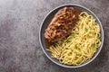 Zwiebelrostbraten German beef roast in onion sauce and spaetzle pasta closeup on the plate. Horizontal top view Royalty Free Stock Photo