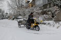 ZÃÂ¼rich: Postman driving through the snow on a motorikeb