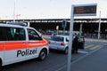 ZÃÂ¼rich/Switzerland: A police car is stopping a vehicle in front of the central station to check the people inside