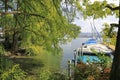 ZÃÂ¼rich: View through green twigs to some boats at the jetty