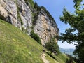 Ãâscher cliff or Ãâscher-Felsen Aescher-Felsen or Ascher-Felsen in the Alpstein mountain range and in the Appenzellerland region Royalty Free Stock Photo