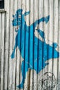 Funny blue cow drawing on the abandoned house
