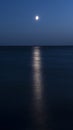 ÃÂ°t night ÃÂ° white moon over the sea with reflection and a path. Royalty Free Stock Photo