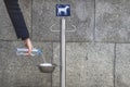 ÃÂ person pours water from a bottle into a bowl for food and drink for street dogs.