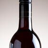 Isolated Red Wine bottle on plain background Stock Photo