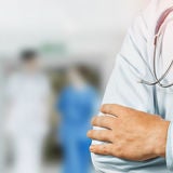 Professional Doctor With Stethoscope In Hospital. Healthcare Medicine Concept