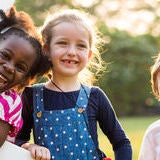 Group of kindergarten kids friends playing playground fun and sm