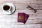 02-08-2021 Portsmouth, Hampshire, UK a pair Of British passports laid on a wooden table next to a coffee and a pair of glasses