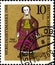 02 10 2020 Divnoe Stavropol Territory Russia the postage stamp Germany 1968 Standing Dolls Doll of 1878 woman in red dress