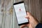 02-10-2021 Portsmouth, hampshire, UK A mobile phone or cell phone being held by a hand with the McAfee Anti-Virus app open on