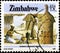 02.11.2020 Divnoe Stavropol Territory Russia the Postage Stamp Zimbabwe 1985 National Infrastructure Woman Crushing Maize