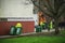 02/18/2020 Portsmouth, Hampshire, UK A group of bin men pulling recycling bins to load on a rubbish truck or garbage truck