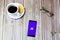 03-22-2021 Portsmouth, Hampshire, UK A mobile phone or cell phone laid on a wooden table with the Anchor by spotify app open on